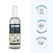 Rear view of the Canni Clean bottle showing composition details alongside icons for Vet Approved, Ayurvedic Formulation, and Plant Based.