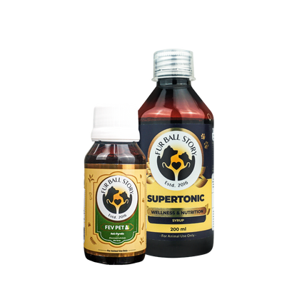 A product shot of Fur Ball Story's Fev Pet syrup bottle standing next to a larger bottle of Supertonic Wellness and Nutrition syrup.