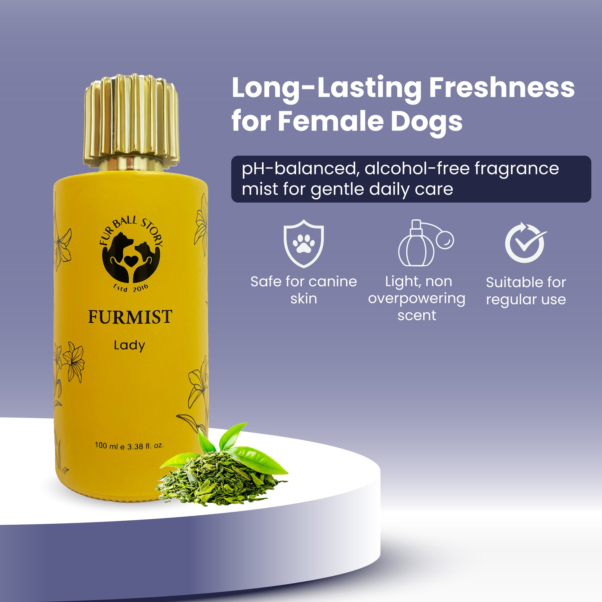 A lifestyle product visual featuring the Furmist Lady bottle resting on a white podium with a pile of fresh green tea leaves at its base. The text describes it as a "Long-Lasting Freshness" mist designed specifically for the gentle care of female dogs.