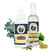 Canni Clean spray and Clear Ear cleanser bottles arranged with eucalyptus leaves, mint, fennel seeds, and a mortar with herbs on a white background.