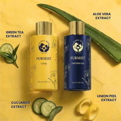 Yellow and blue Furmist bottles displayed flat with fresh green tea leaves, aloe vera stalks, cucumber slices, and lemon peel twists.
