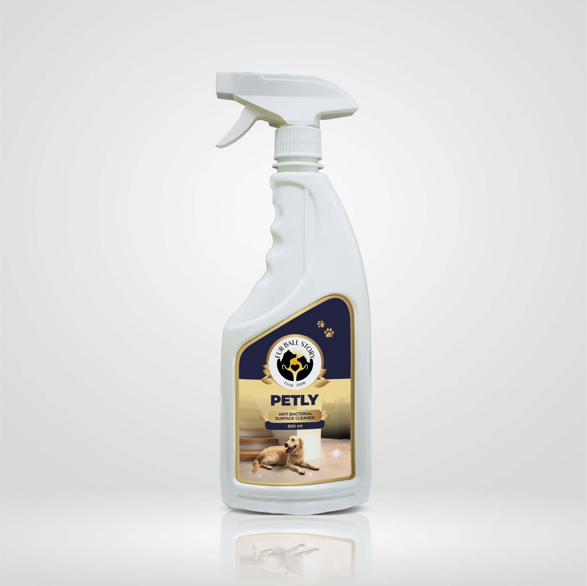 Front view of a white spray bottle of Petly Antibacterial Surface Cleaner featuring a dog on the label.