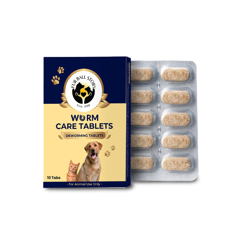 Front view of Fur Ball Story Worm Care Tablets packaging next to a blister pack containing ten light brown, oval-shaped deworming tablets for dogs and cats.