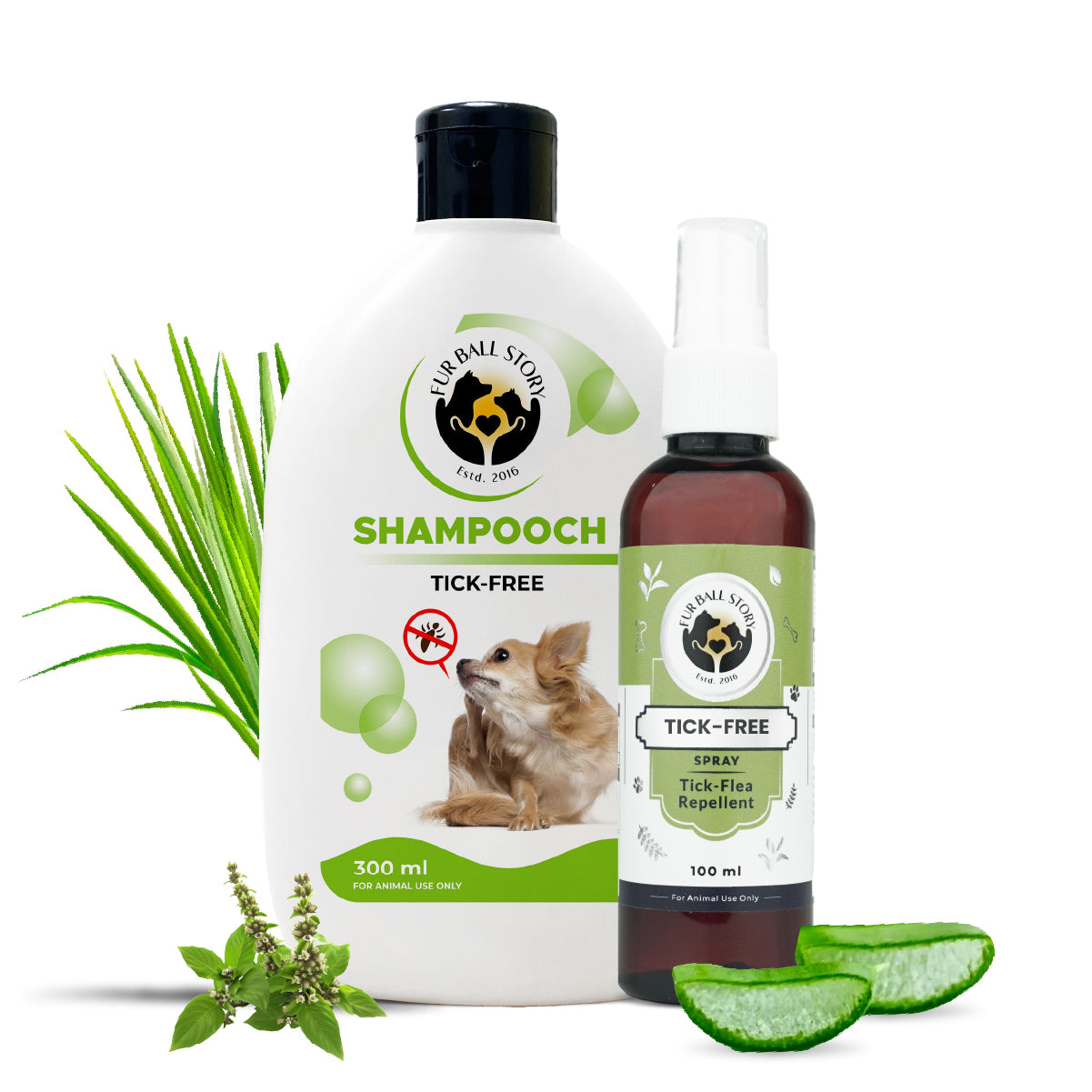 A white 300ml bottle of Fur Ball Story Shampooch Tick-Free shampoo next to a 100ml bottle of Tick-Free Spray, flanked by green grass, herbs, and aloe vera slices.